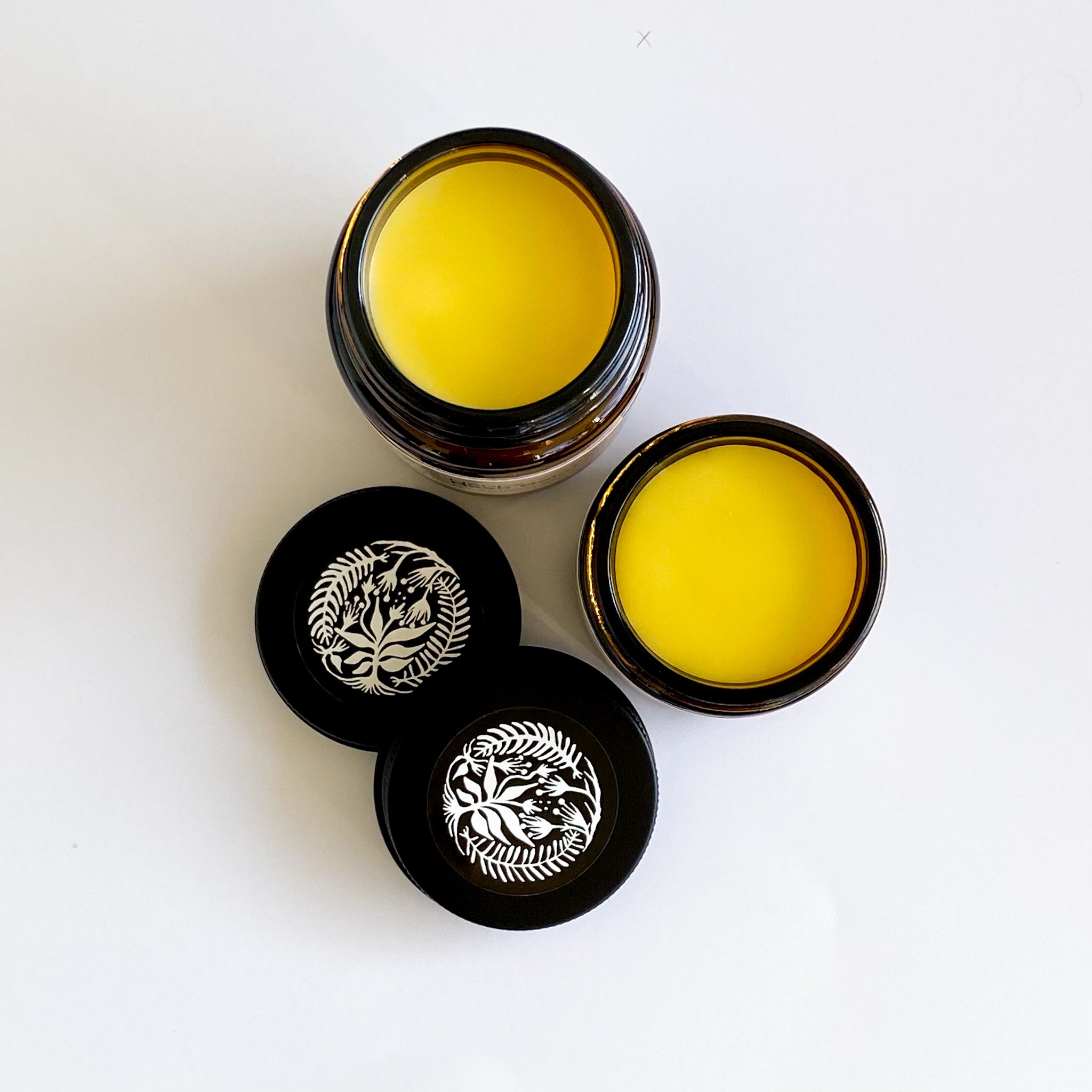 two open jars showing nappy rash balm for sensitive skin from above