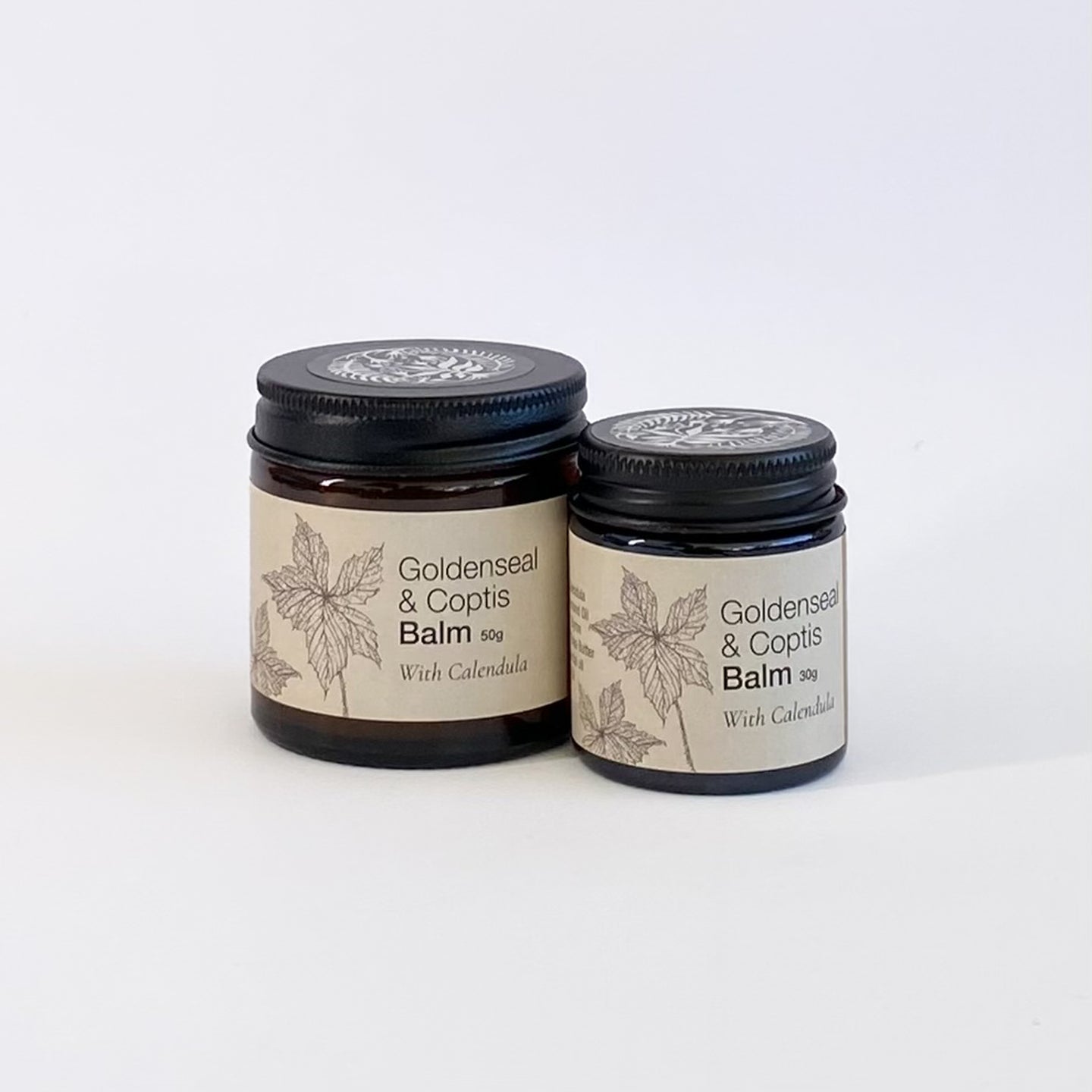 Two jars of Goldenseal & Coptis Balm on a white background