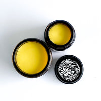 open jars of Herbal Healing balm