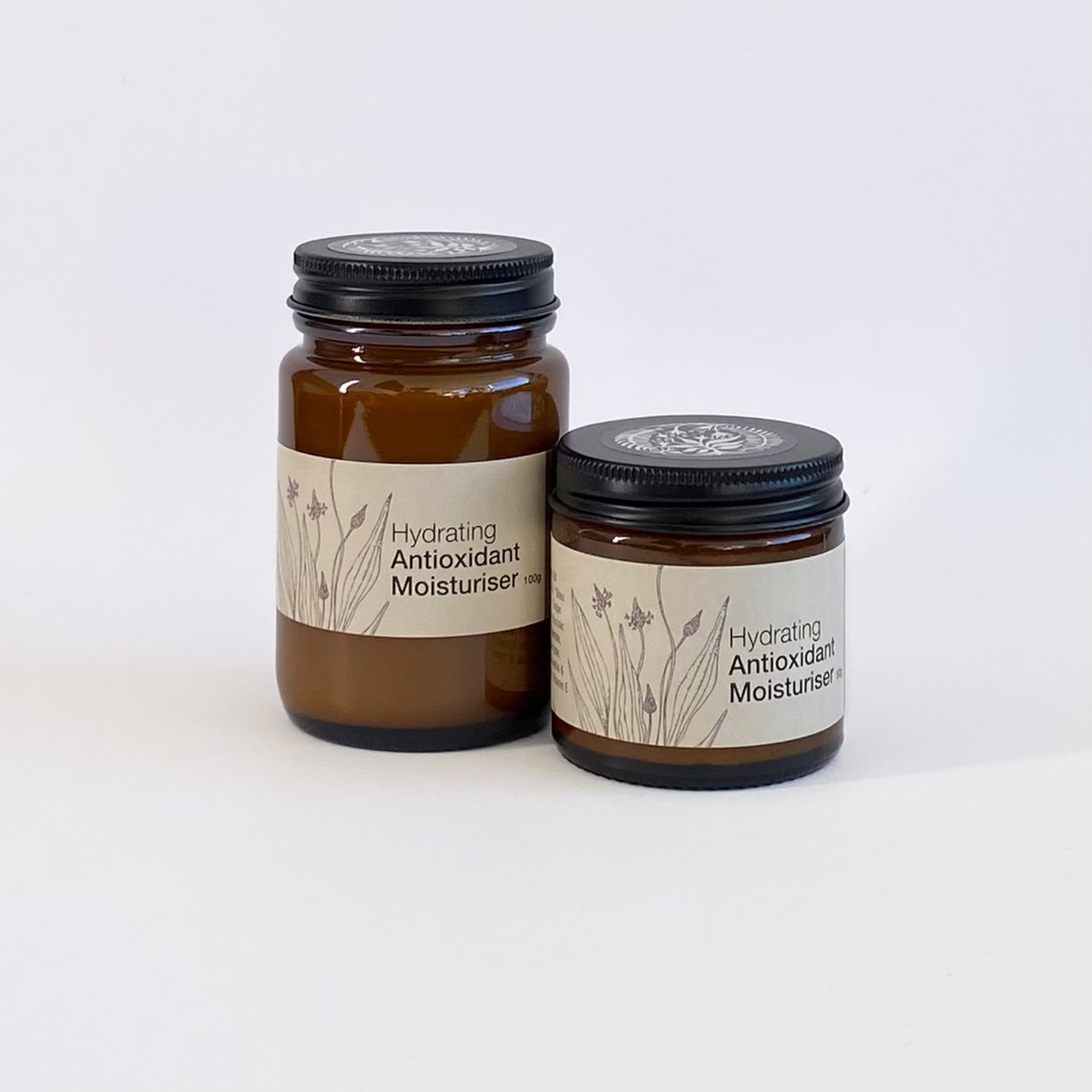 Two jars of hydrating antioxidant moisturizer on a white background