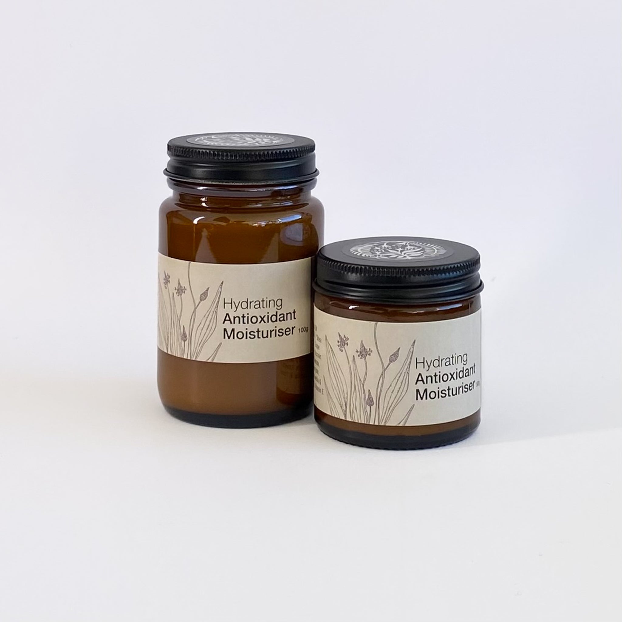 Two jars of hydrating antioxidant moisturizer on a white background