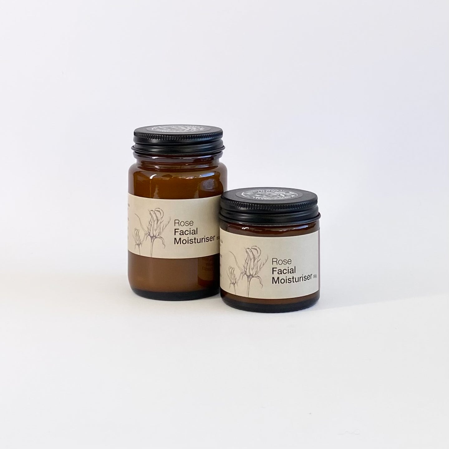 Two jars of Rose Facial Moisturizer on a white background